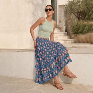 Woman wearing the Slate Coral Tile Print Tiered Ruffle Maxi Skirt by Creamy Cougar