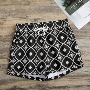 Woman wearing the Black & White Diamond Medallion Print Casual Shorts by Creamy Cougar