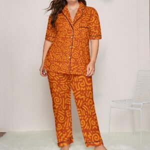 Woman wearing the Tangerine Paisley Print Satin Pajama Set by Creamy Cougar