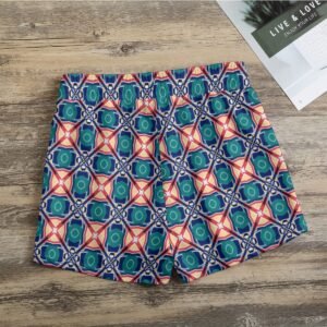 Woman wearing the Emerald Coral Mosaic Print Casual Shorts by Creamy Cougar