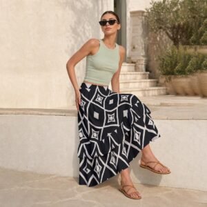 Woman wearing the Black & White Ikat Print Tiered Ruffle Maxi Skirt by Creamy Cougar