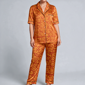 Woman wearing the Tangerine Paisley Print Satin Pajama Set by Creamy Cougar
