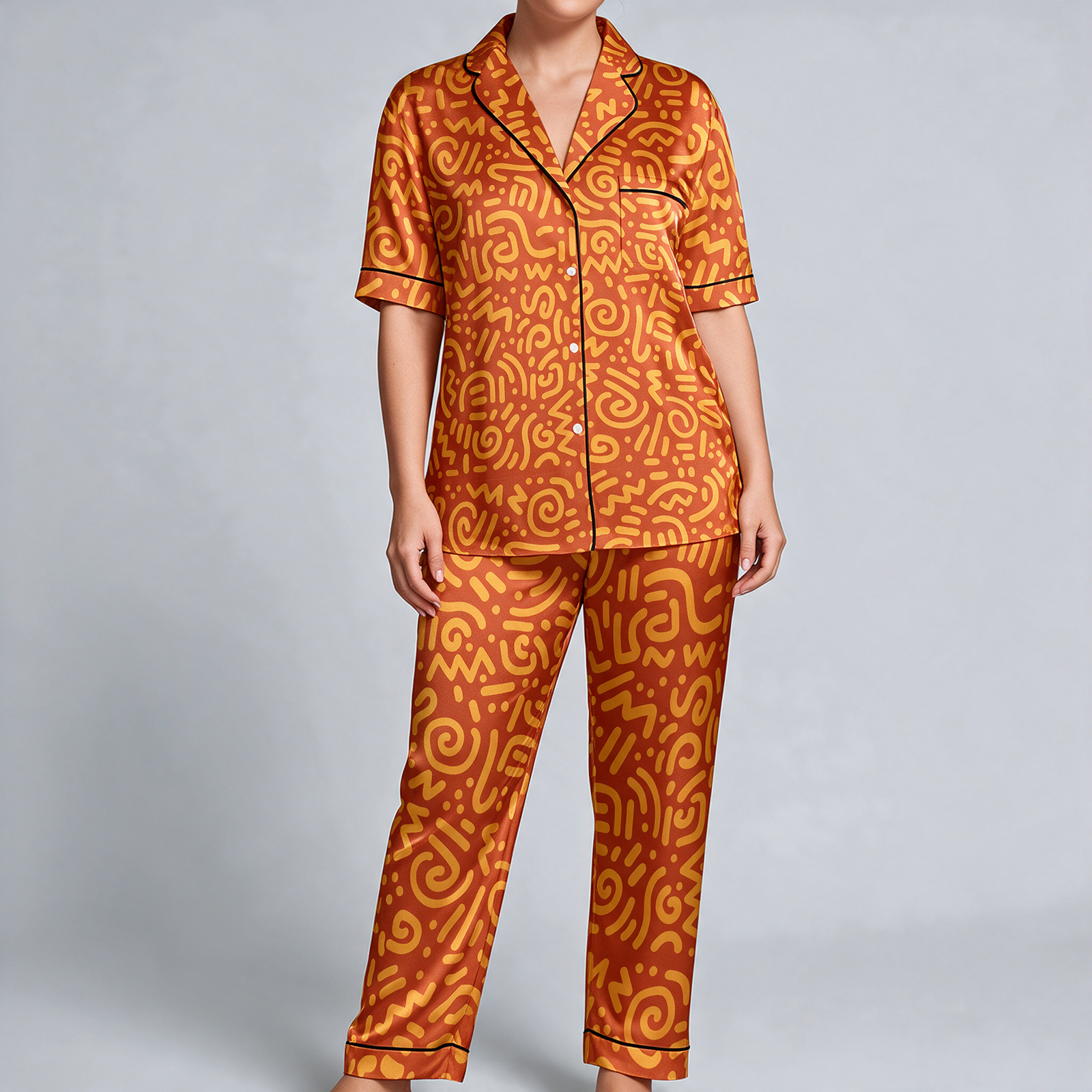 Woman wearing the Tangerine Paisley Print Satin Pajama Set by Creamy Cougar