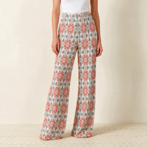 Woman wearing the Blush Coral Mosaic Print Wide Leg Pants by Creamy Cougar