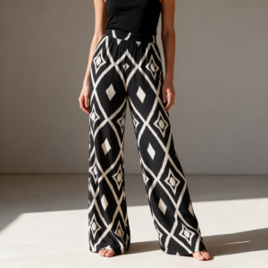 Woman wearing the Black & White Ikat Print Wide Leg Pants by Creamy Cougar