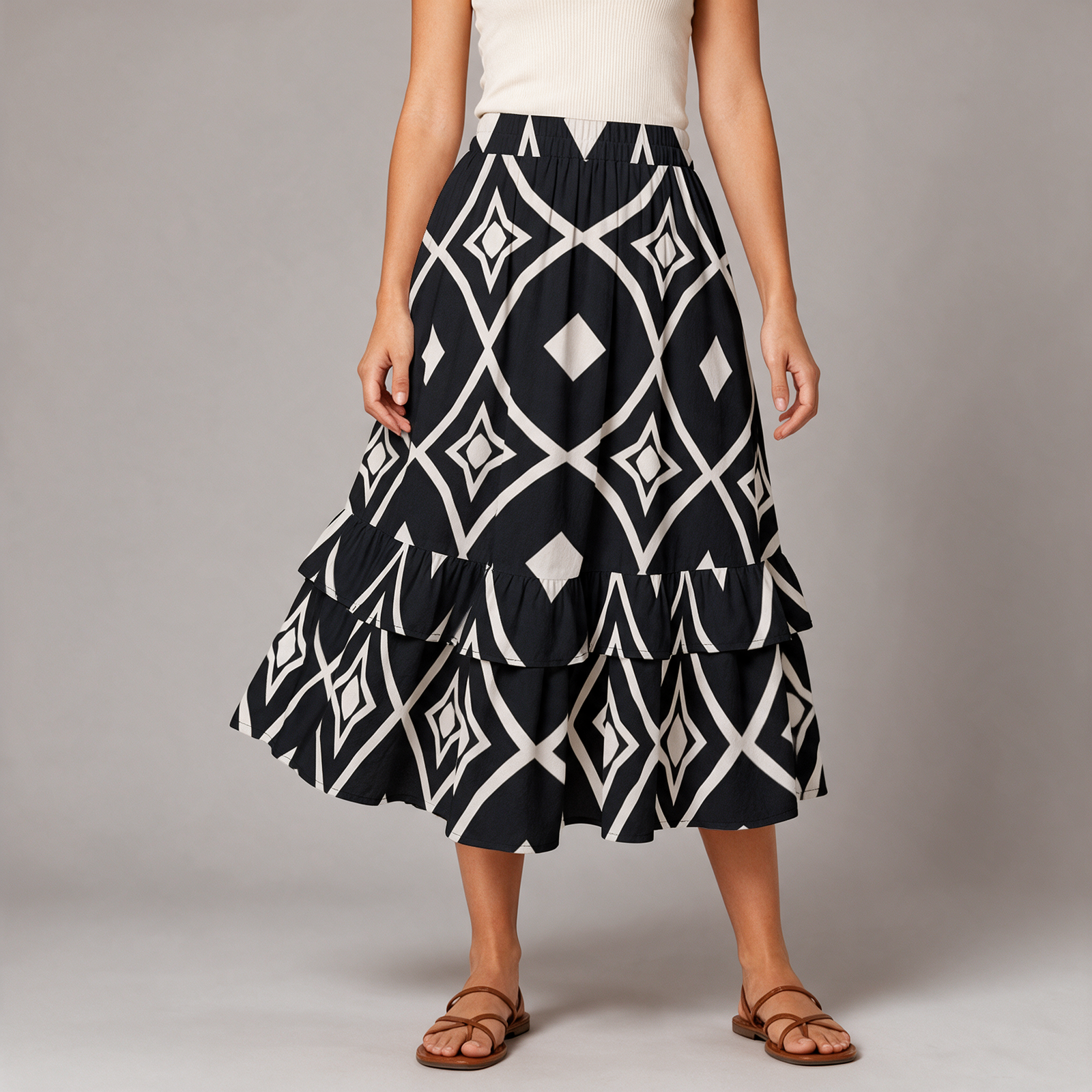 Woman wearing the Black & White Ikat Print Tiered Maxi Skirt by Creamy Cougar