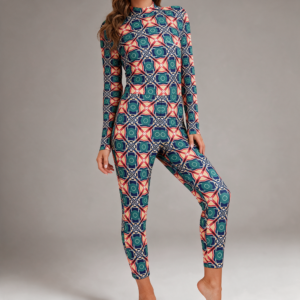 Woman wearing the Coral Teal Medallion Print Long Sleeve High-Neck Jumpsuit by Creamy Cougar