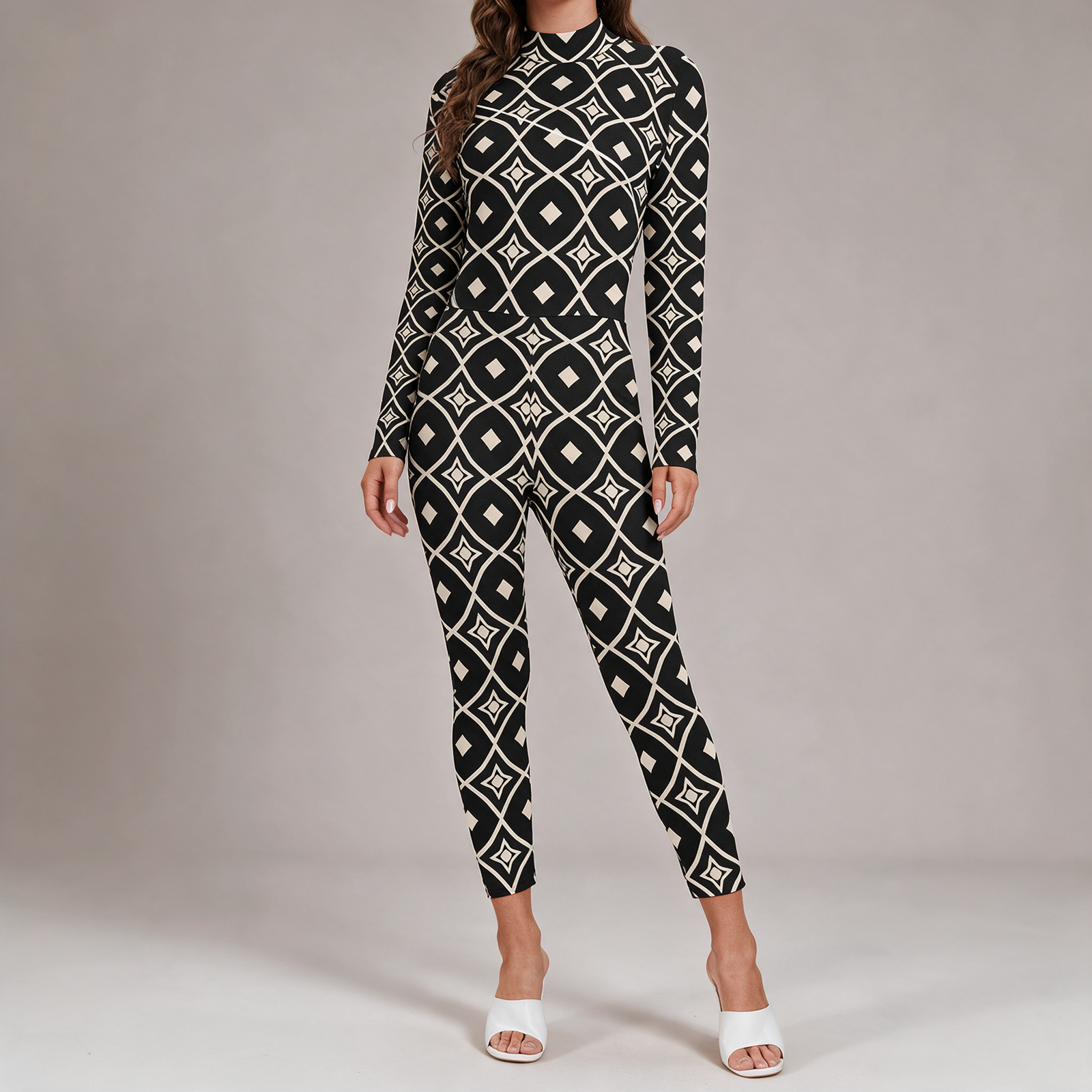 Woman wearing the Black & White Diamond Print Long Sleeve High-Neck Jumpsuit by Creamy Cougar